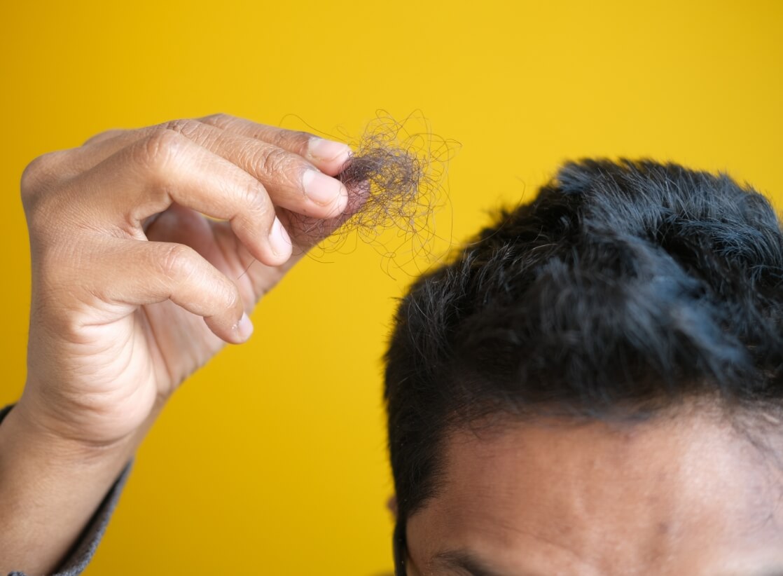 man-hold-his-list-hair-close-up-2023-11-27-05-28-15-utc (2)