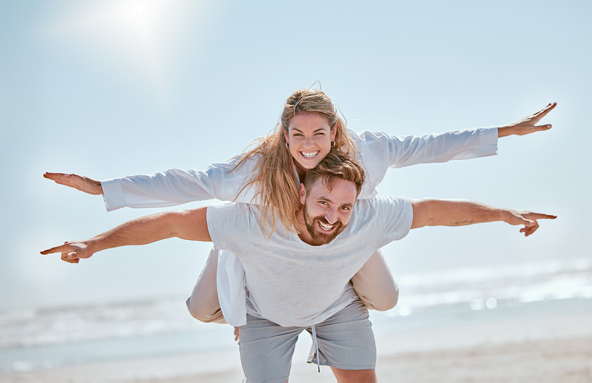 playful-travel-and-couple-with-freedom-at-the-bea-2023-11-27-04-54-15-utc (1)